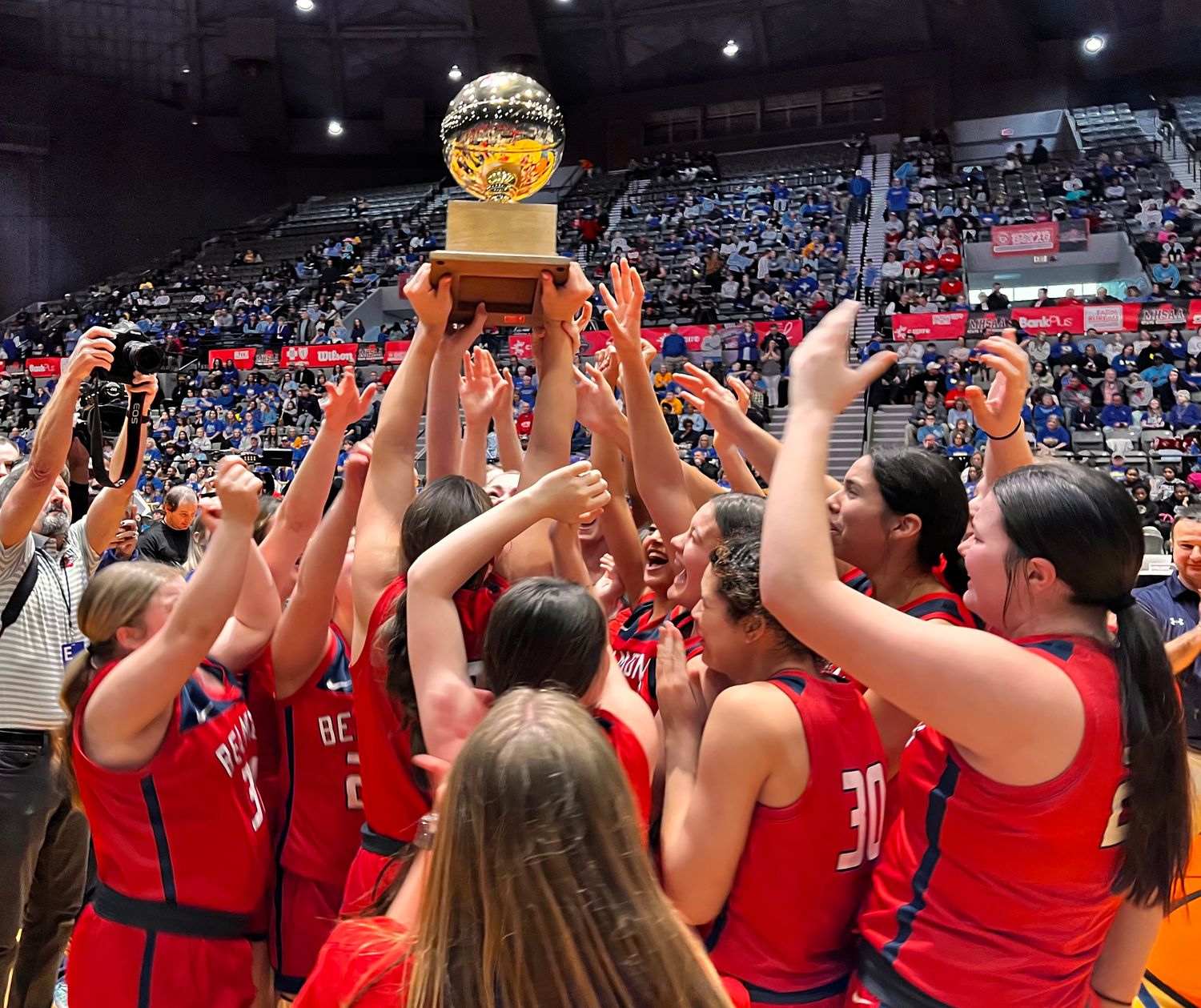 The Belmont Lady Cardinals hoist the 2023-2024 MHSAA Class 3A State Championship trophy after defeating Booneville 40-39 on Friday, March 1, 2024 at the Mississippi Coliseum in Jackson, Miss.